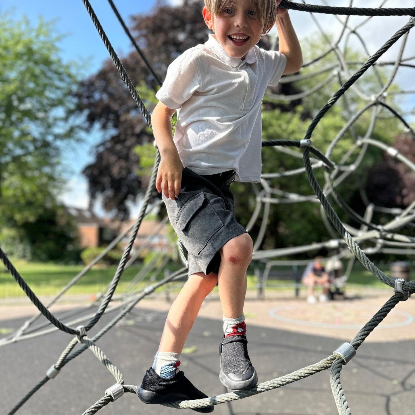 black Dubs Flex wide-fit sensory-friendly kids trainer, climbing frame