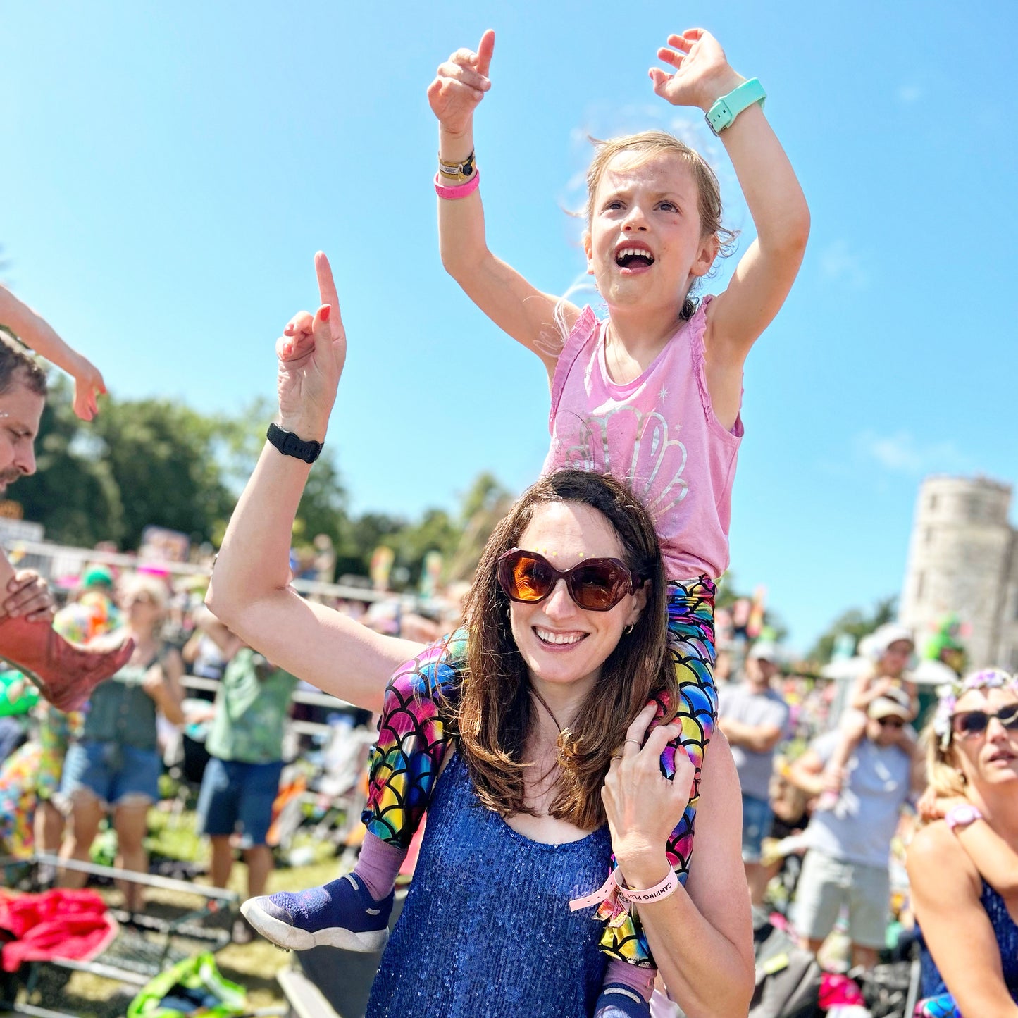 Blue Dubs Flex wide-fit sensory-friendly kids trainer, girl at festival with mum
