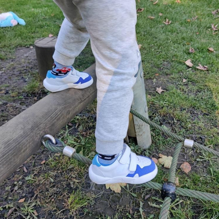 Blue and white Dubs glide wide-fit quality durable leather kids trainer, climbing frame. 