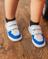 Blue and white Dubs glide wide-fit quality durable leather kids trainer, close up view